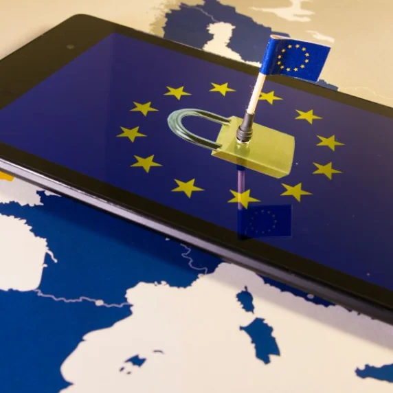 European Union flag sticking out of a screen with the GDPR logo